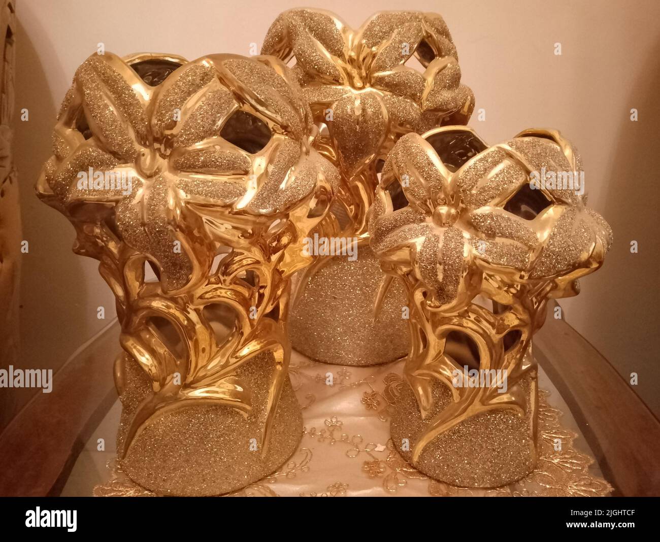 Three very beautiful gold flower vases look elegant even without flowers Stock Photo Alamy