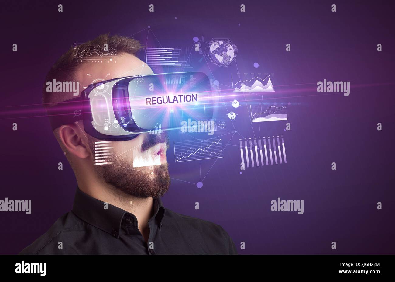 Businessman looking through Virtual Reality glasses Stock Photo