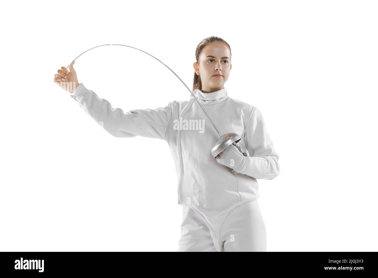 Young girl, fencer in white fencing costume posing with rapier isolated