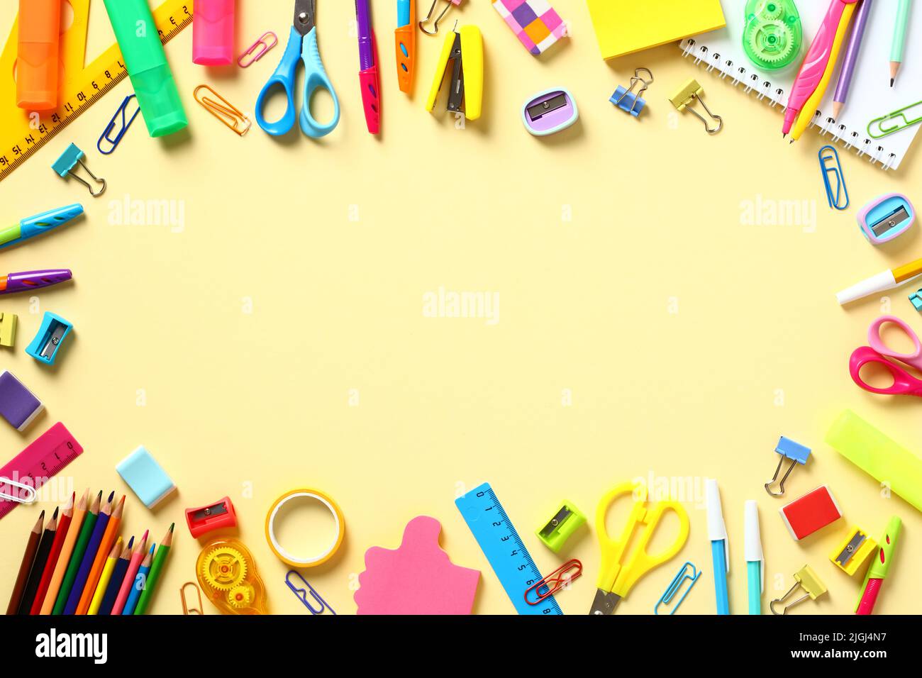 Back to school concept. Frame made of colorful school supplies on ...