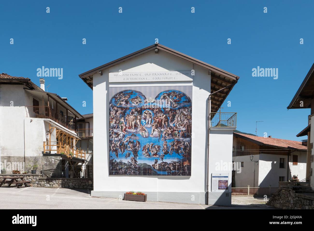 Cercivento, Italy (8th July 2022) - Reproduction of Michelangelo's Last Judgment on the wall of a building in a central court Stock Photo