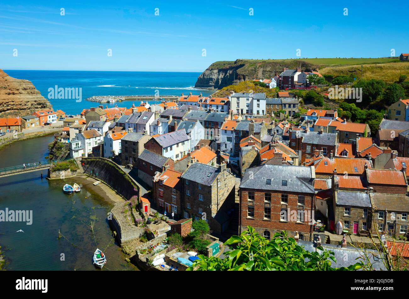 View looking seawards over the harbour of the North Yorkshire Village of Staithes on the Soutth side of Roxby Beck Stock Photo