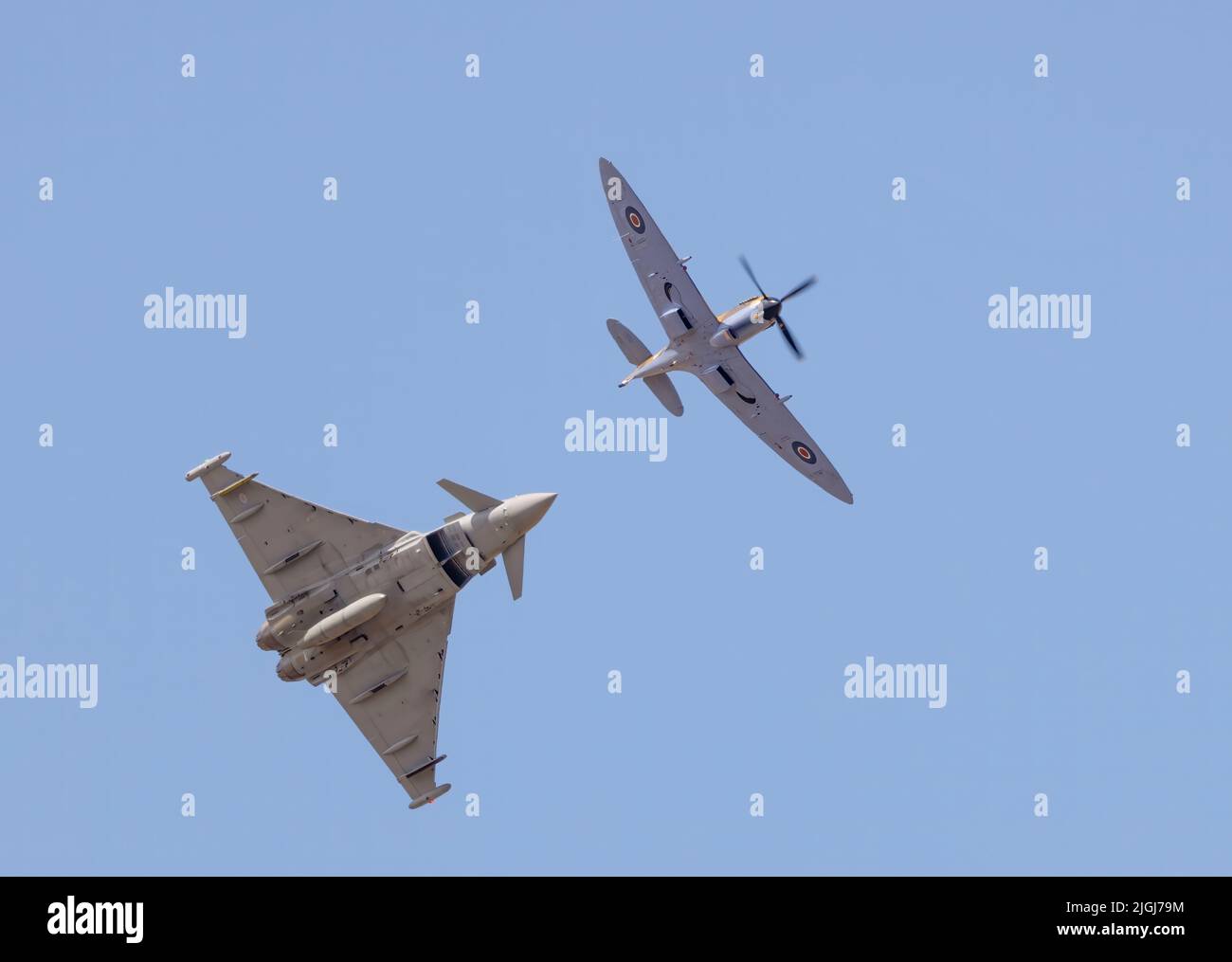 A Spitfire and RAF Typhoon fly together in formation at the Southport Air Show, Southport, Merseyside, UK Stock Photo