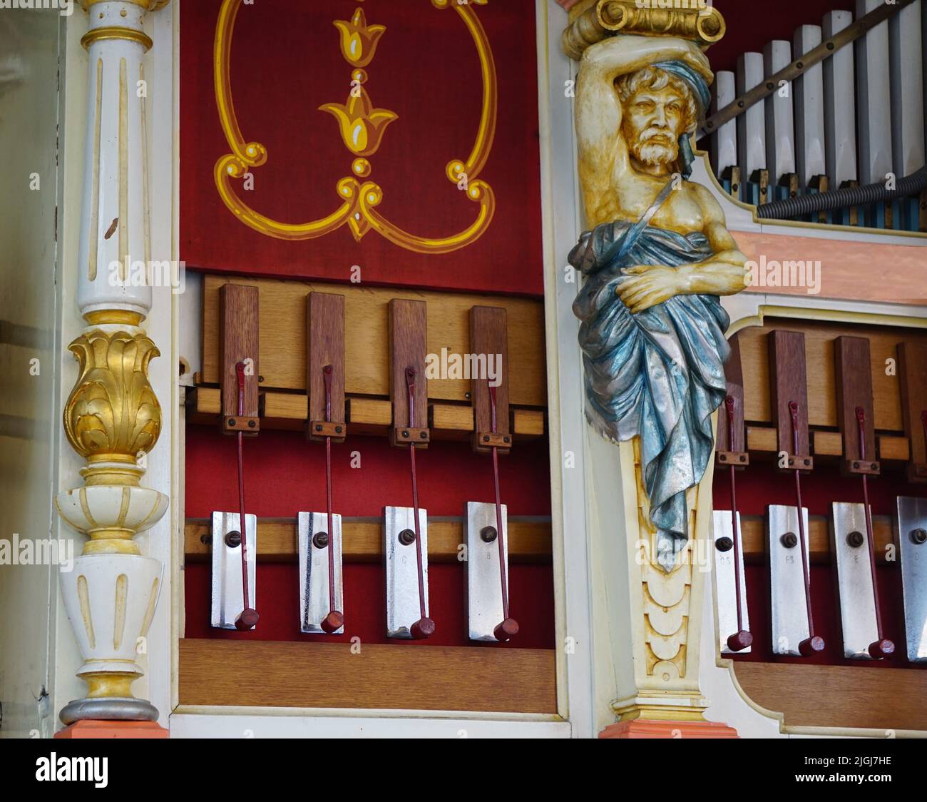 An organ keyboard instrument with beautiful religious decorations in a