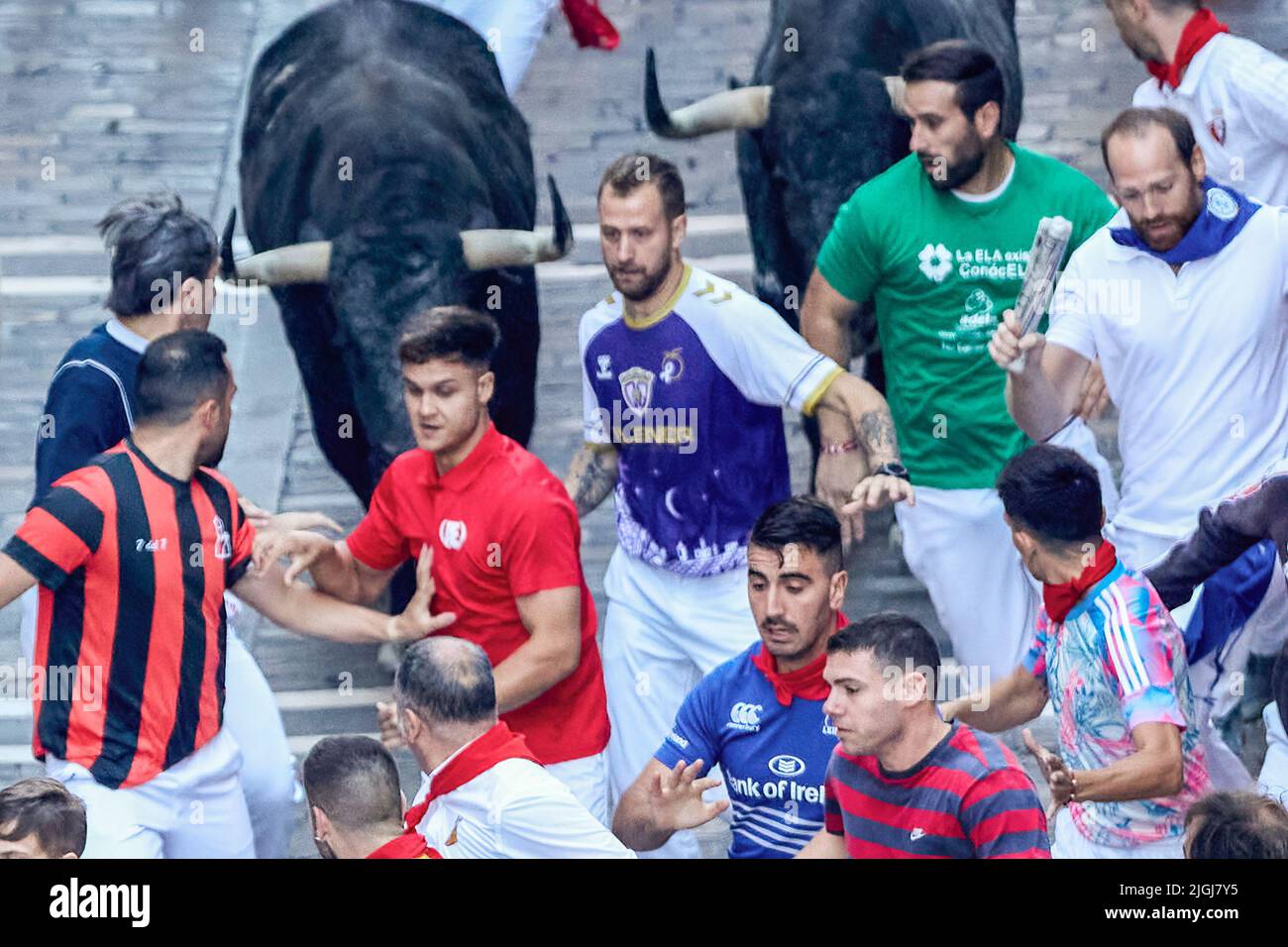 Pamplona, Spain. 11th July, 2022. Men run in front of the bulls from the livestock of Cebada Gago, in the fifth day of the running of the bulls in San Fermin Pamplona. (Photo by Fernando Pidal/SOPA Images/Sipa USA) Credit: Sipa USA/Alamy Live News Stock Photo