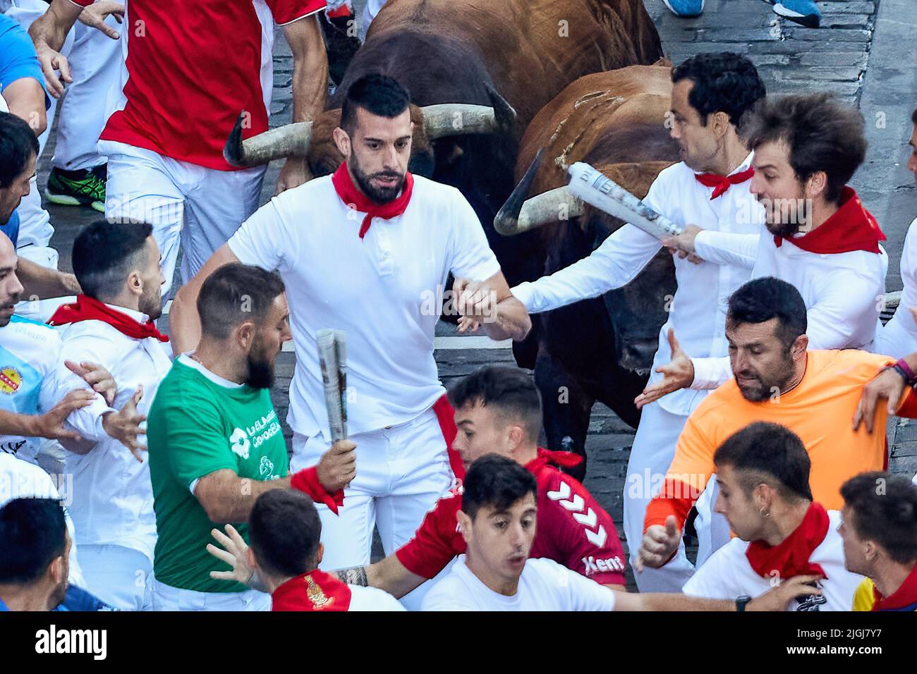 Pamplona, Spain. 11th July, 2022. Men run in front of the bulls from the livestock of Cebada Gago, in the fifth day of the running of the bulls in San Fermin Pamplona. (Photo by Fernando Pidal/SOPA Images/Sipa USA) Credit: Sipa USA/Alamy Live News Stock Photo