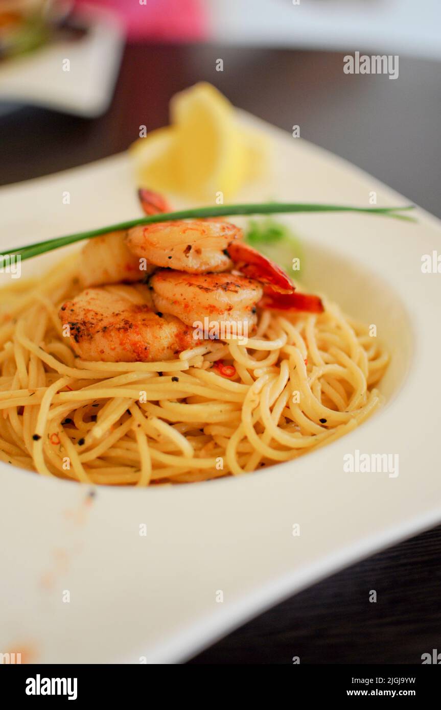 A delicious serving of Spaghetti Aglio Olio with prawns, a traditional