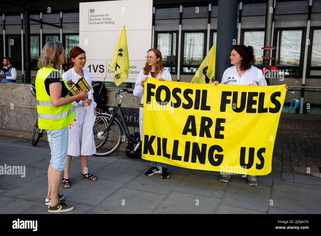 London, UK. 11th July, 2022. Climate activists from Extinction Rebellion protest outside the Department for Business, Energy and Industrial Strategy (BEIS) as part of a Stop Coal tour. The activists are calling for no licences or planning consents to be granted for coal extraction by the Coal Authority, an executive non-departmental public body sponsored by BEIS, anywhere in the UK. Credit: Mark Kerrison/Alamy Live News Stock Photo