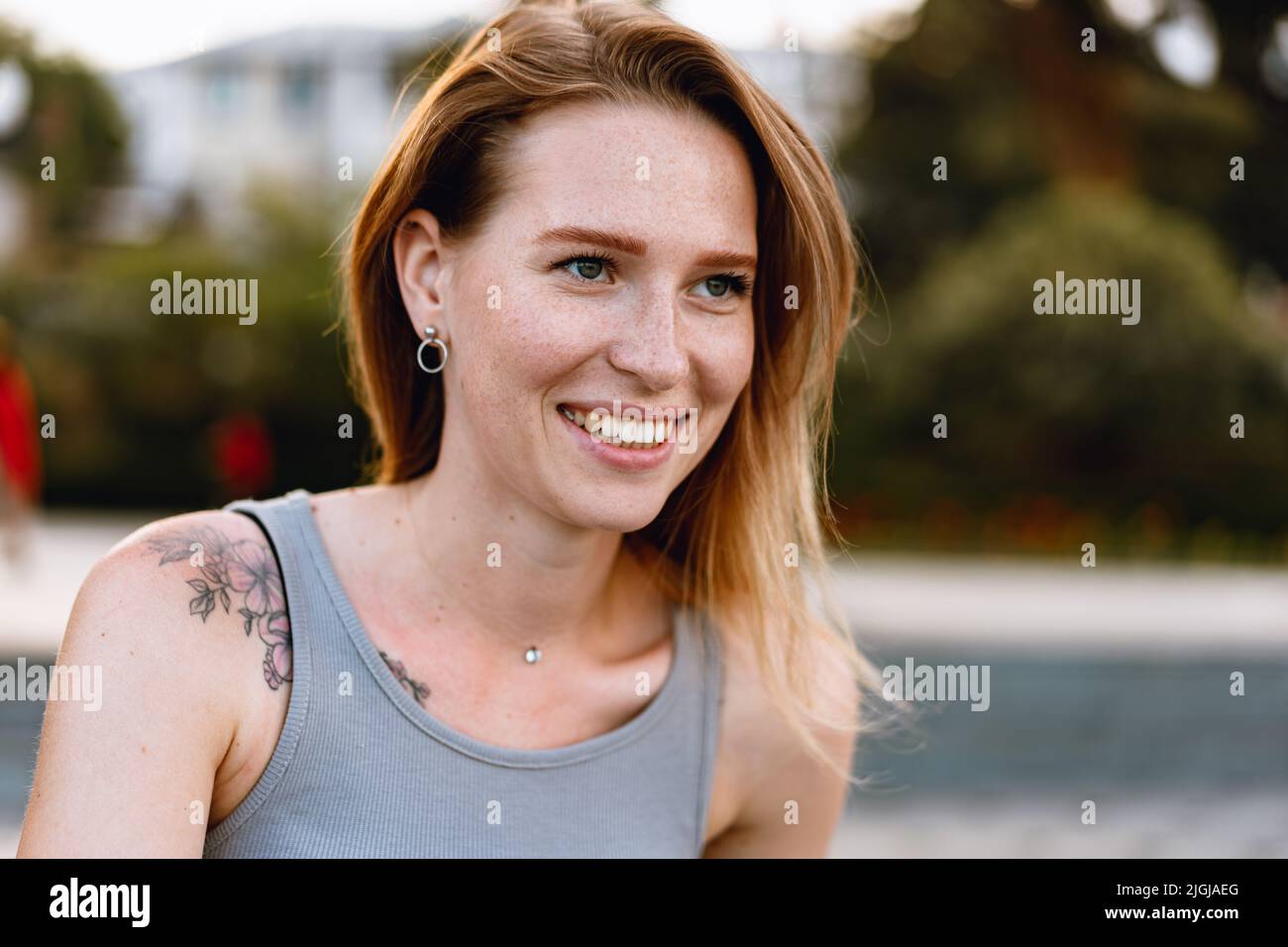 Portrait of a beautiful young woman outdoors Stock Photo - Alamy