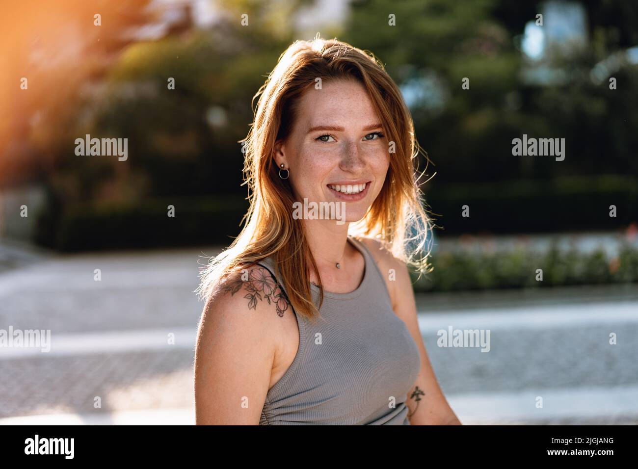 Portrait of a beautiful young woman outdoors Stock Photo - Alamy