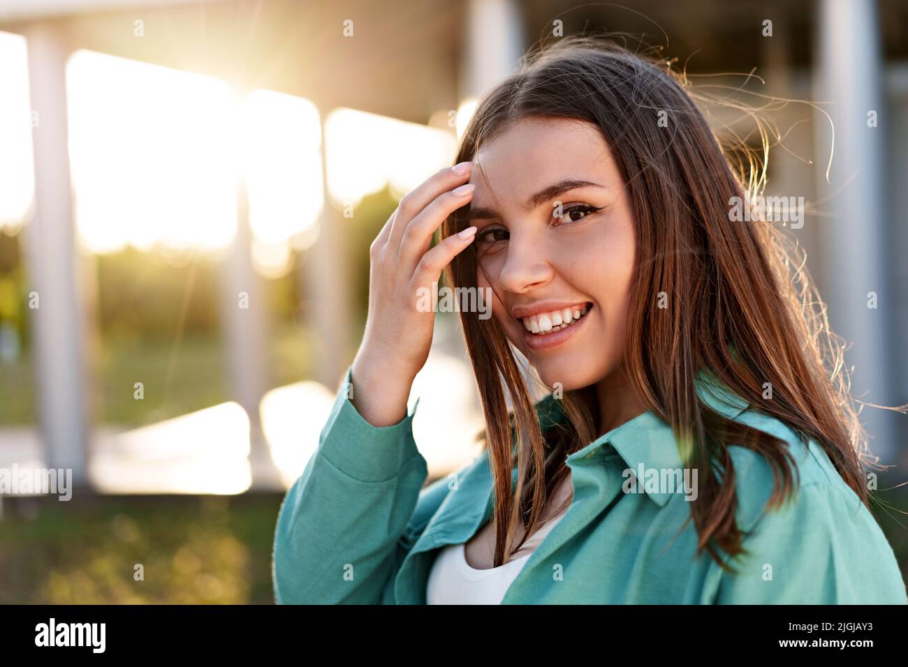 Close up portrait of a young smiling brunette woman Stock Photo - Alamy