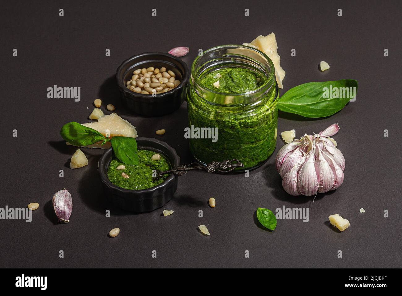 Classic Italian basil pesto sauce in a glass jar. Homemade food ...
