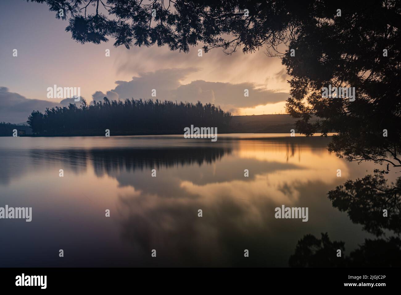 Serene view of a lake during sundown captured using long exposure with
