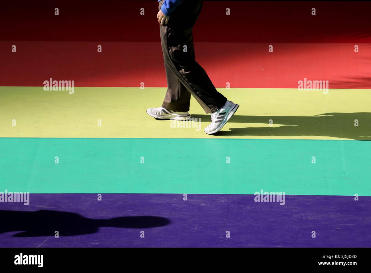 Pedestrians walk on a rainbow runway in front of Siam Center in Bangkok. Lawmakers in Thailand gave initial approval to legalizing same-sex unions, a step closer towards becoming the second territory in Asia to legalize same-gender marriages. Thailand. Stock Photo