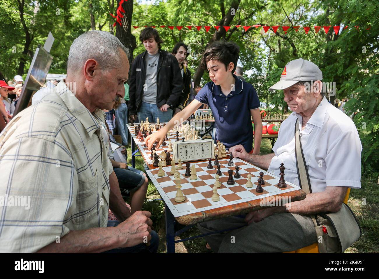 Odessa, Ukraine. 31st Mar, 2022. Elderly men play chess at the