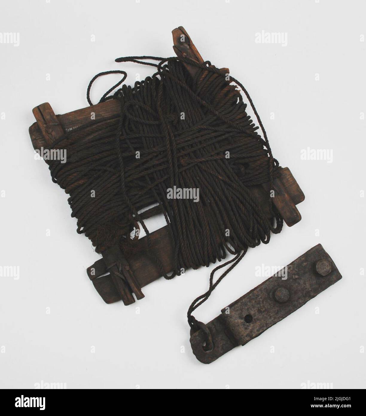 Lod Solder with rope. Lina wrapped on haspa (frame) of wood, the solder