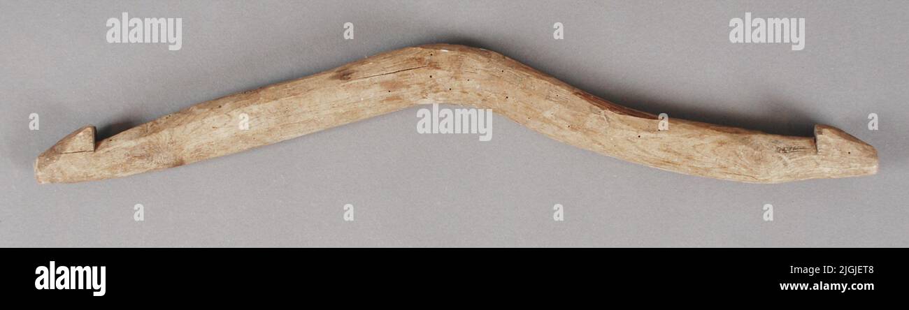 Slaktbåge Offbow. Self -grown wooden arch. Bark and cut. At the ends cut hooks. Acquired in 1982, from Almö. Stock Photo
