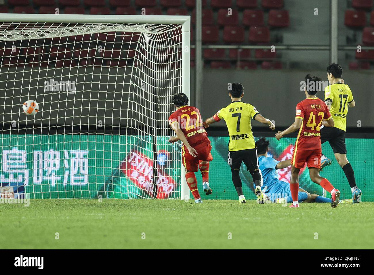 Dalian, China's Liaoning Province. 11th July, 2022. Yang Liyu (1st R) of Guangzhou scores a goal