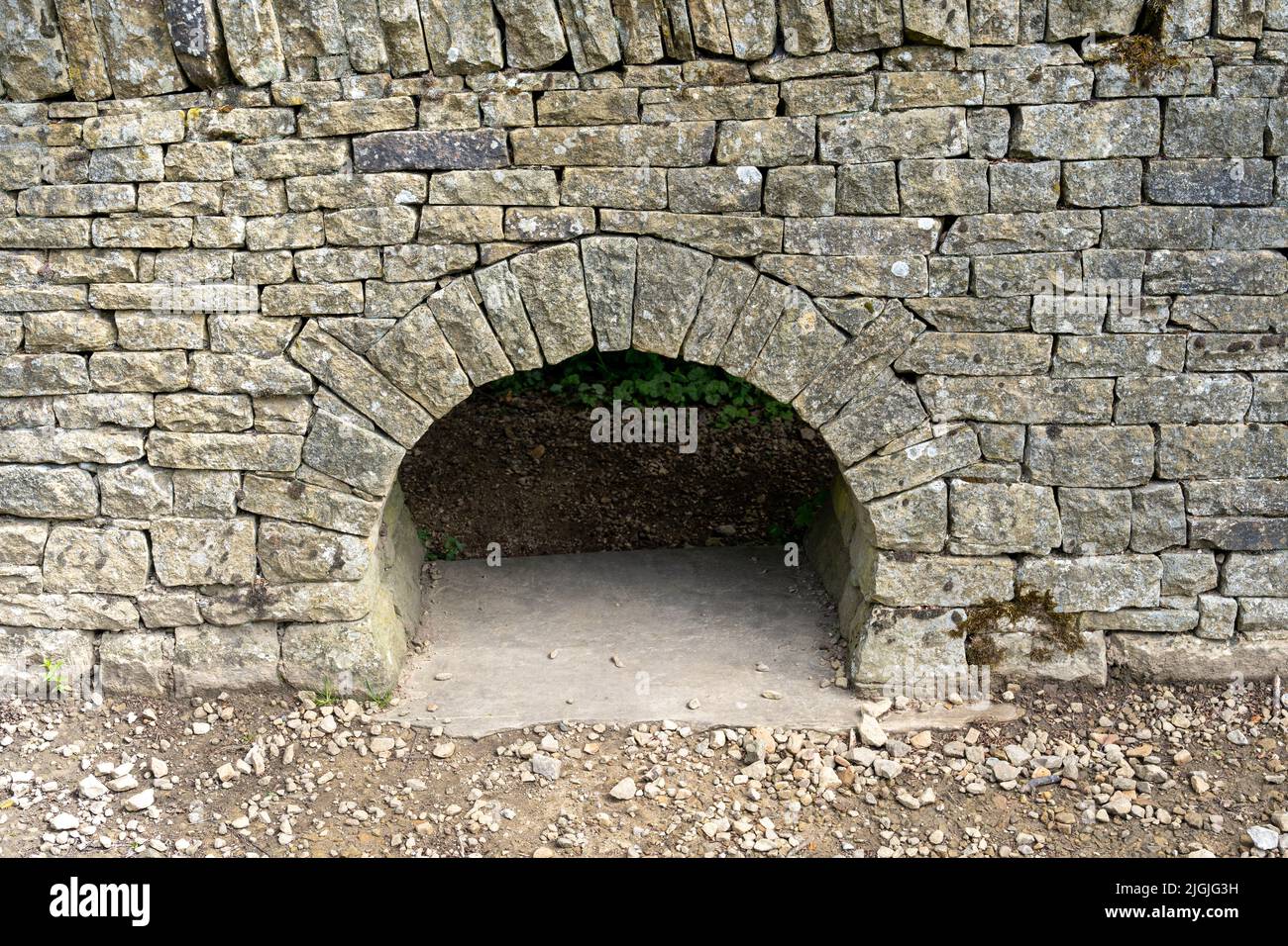 A lunky, also known as a creep-hole or hog-hole, used for a farmer to control the passage of sheep from one field to another in the UK. Stock Photo