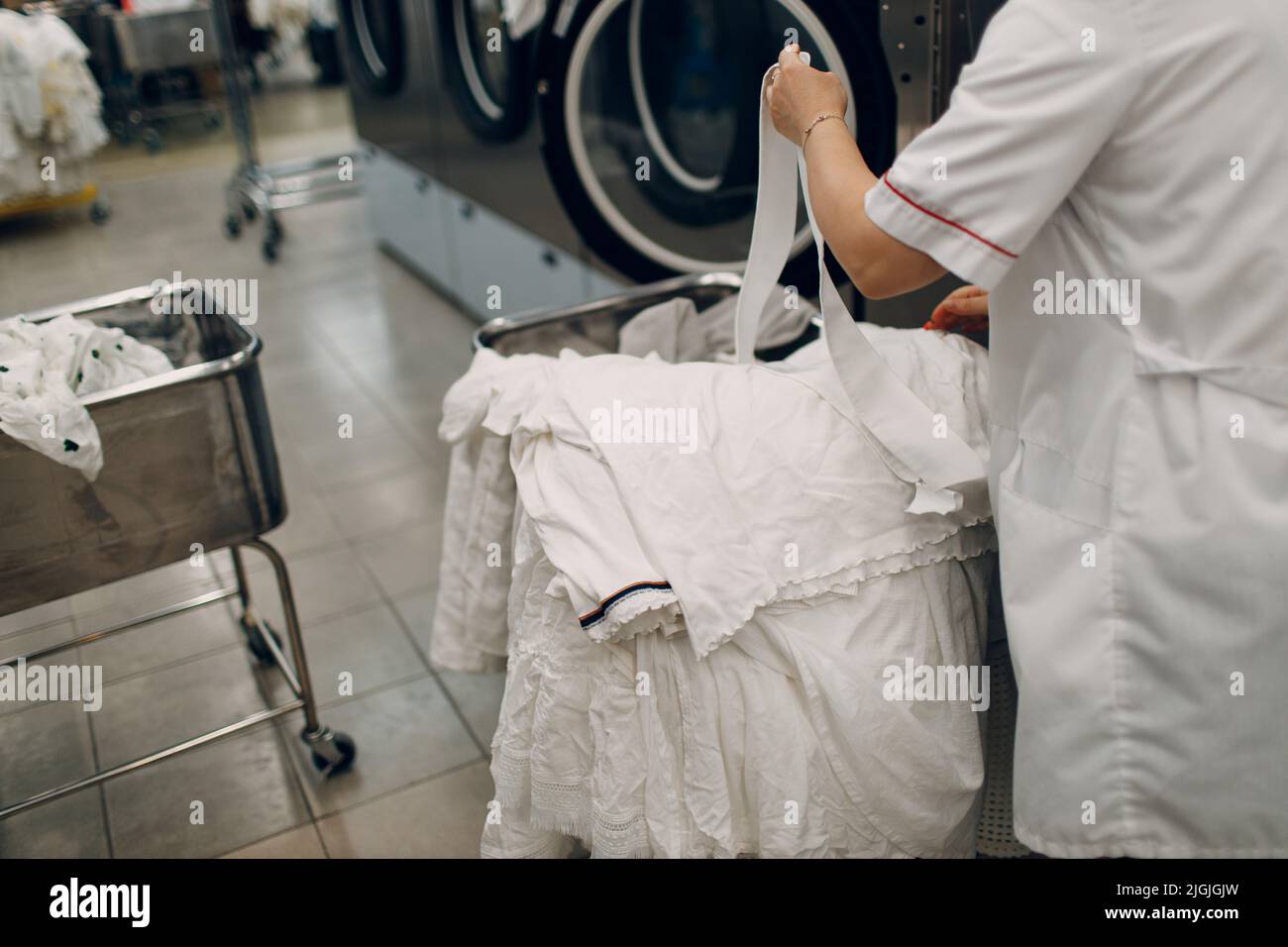 Dry cleaning clothes. Clean cloth chemical process. Laundry industrial