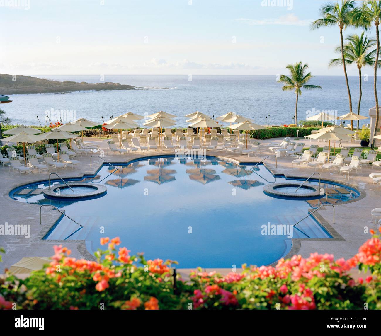 The main Swimming Pool at Four Seasons Resort Lana'i at Manele Bay. Lana'i, Hawaii, USA. Stock Photo