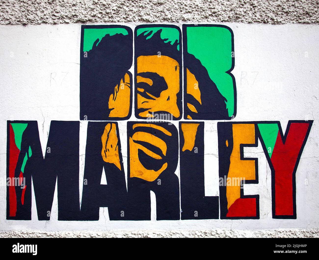Jamaica, Kingston.The Bob Marley museum. Outside are paintings on one of the walls. Stock Photo