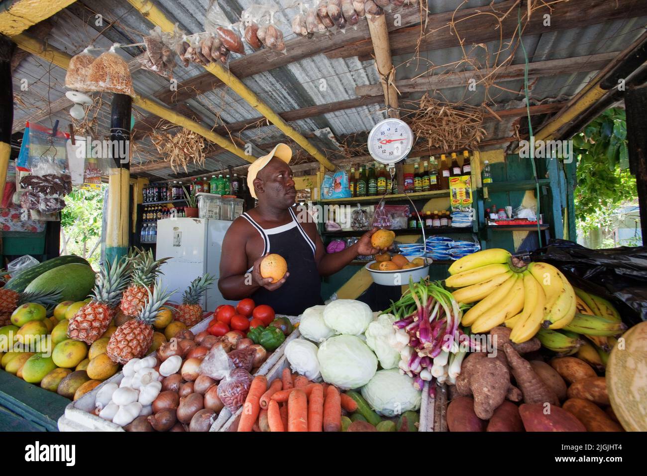 Jamaica, just before Morant Bay a man is having a vegetable and fruit