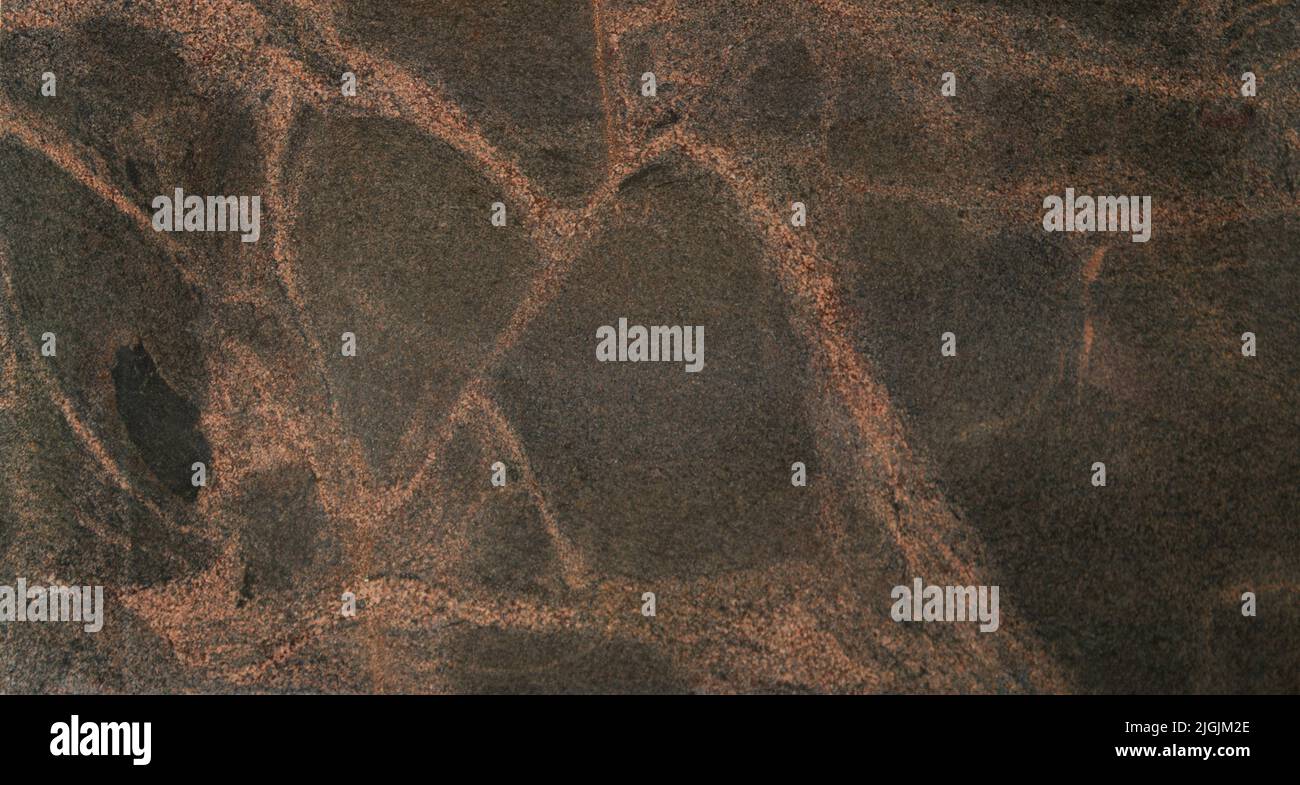 Dark grey stone texture with light red veins Stock Photo