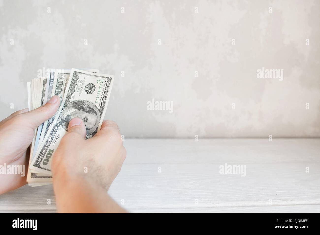 Hands counting american money, free space Stock Photo