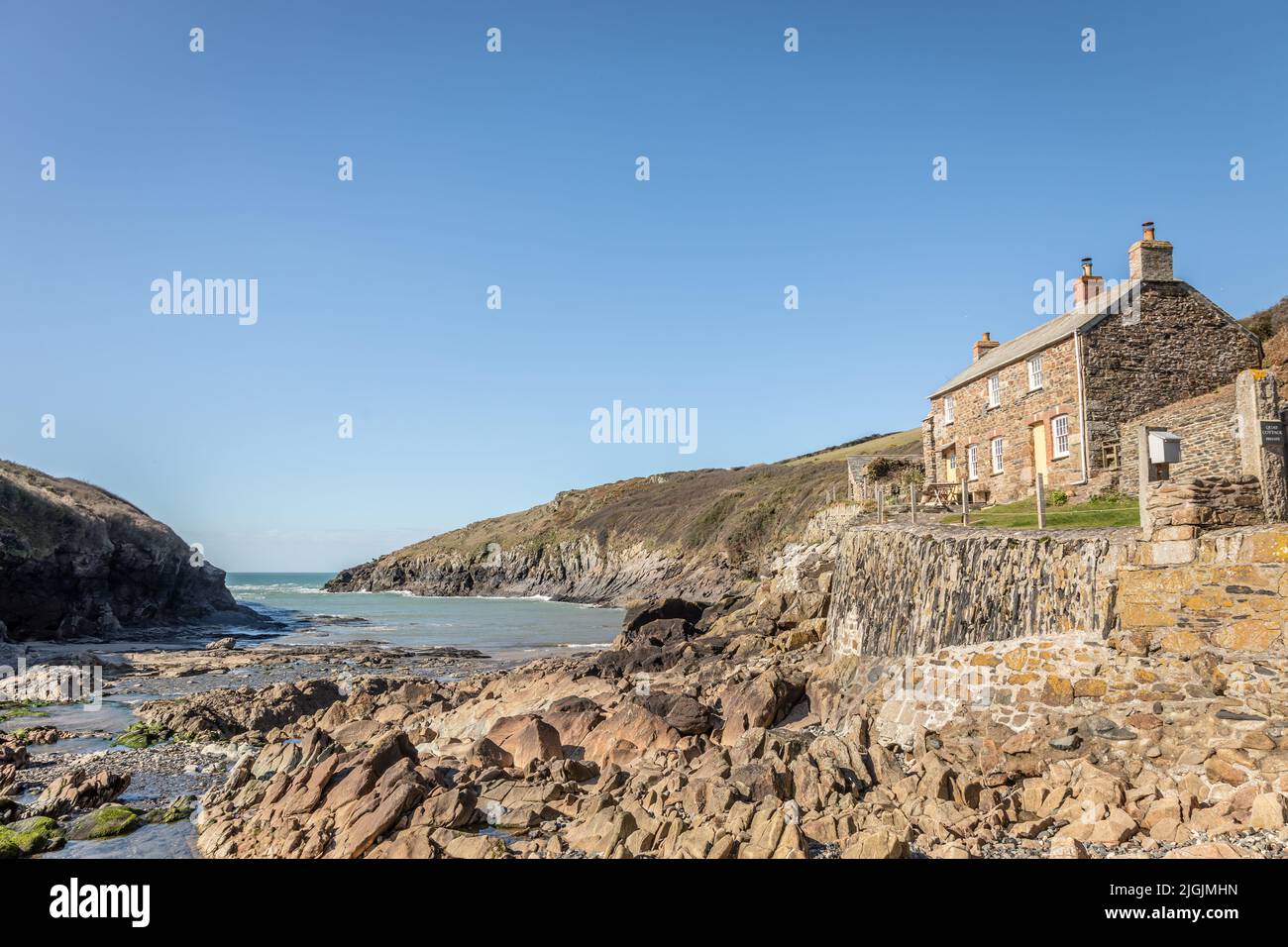 View of the Harbour and Beach at Port Quin, Cornwall, England, UK Stock Photo