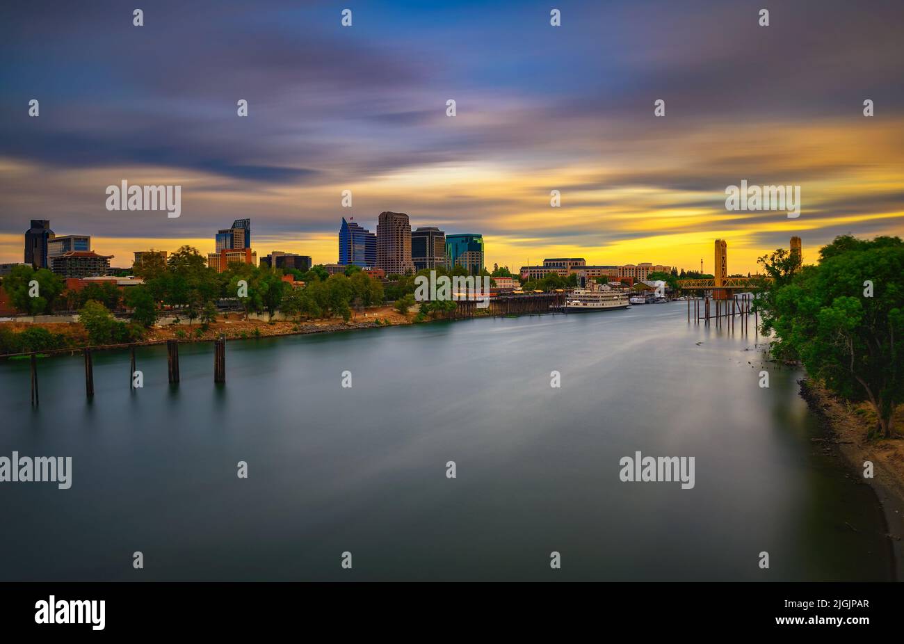 Sunset above Sacramento skyline, Sacramento River and Tower Bridge in California Stock Photo