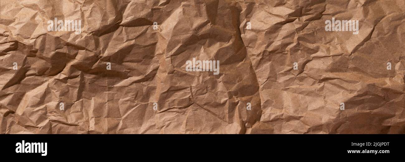 Brown crumpled, wrinkled recycle craft paper texture background banner ...