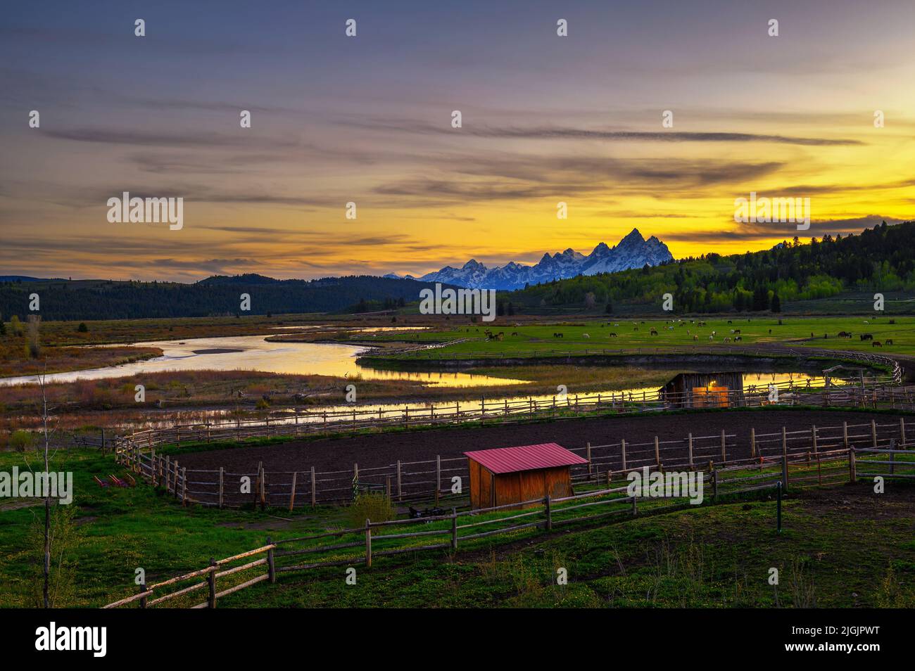 Sunset above the Grand Teton Mountains and Buffalo Fork of the Snake River Stock Photo