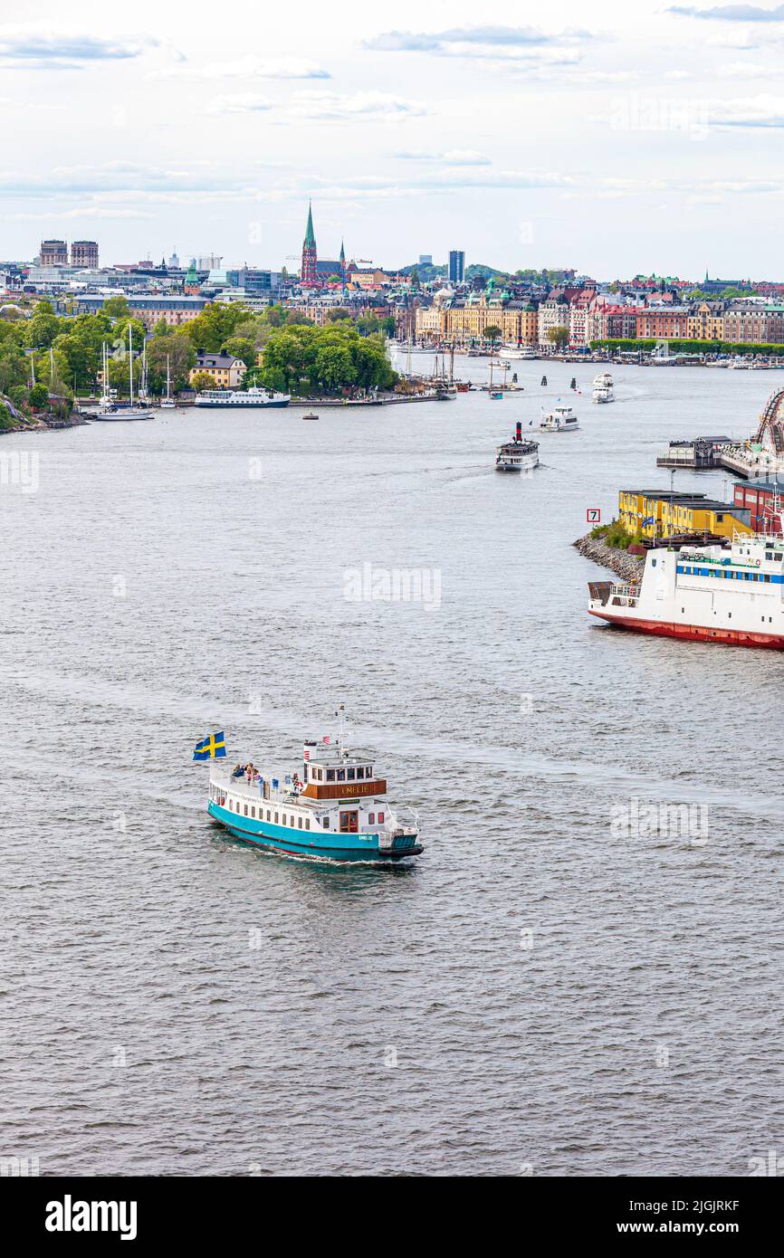 The MS Emelie ferry leaving Stockholm and rounding Djurgården Island into the Stockholm Archipelago, Sweden Stock Photo