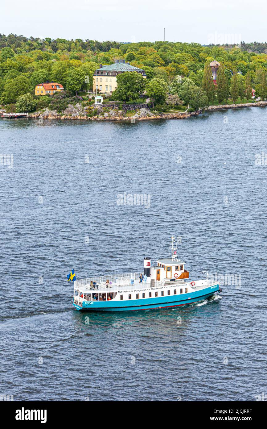 The MS Emelie ferry leaving Stockholm and rounding Djurgården Island into the Stockholm Archipelago, Sweden Stock Photo
