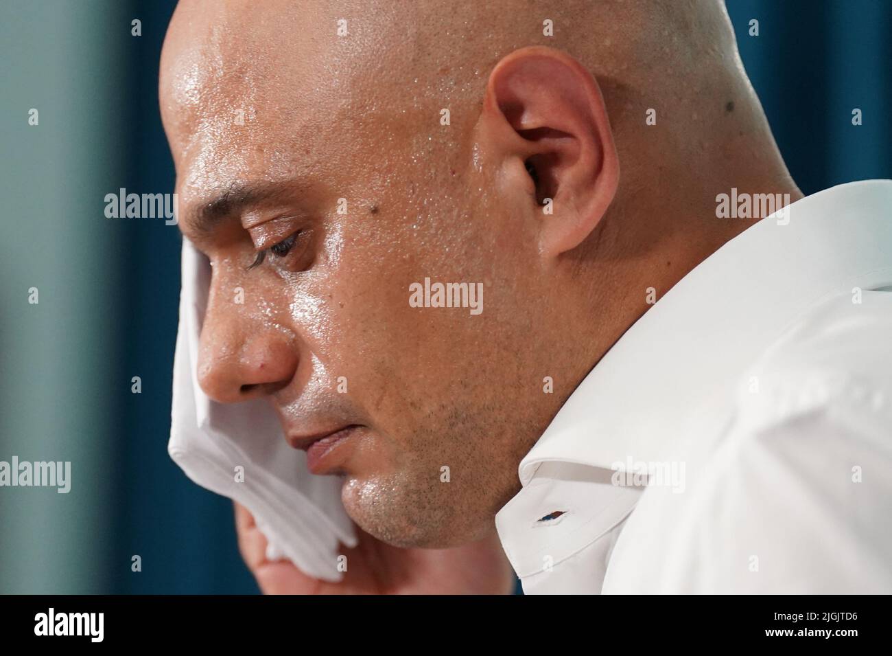 Sajid Javid mops his face during the launch of his campaign to be Conservative Party leader and Prime Minister, at the Cinnamon Club in London. Picture date: Monday July 11, 2022. Stock Photo