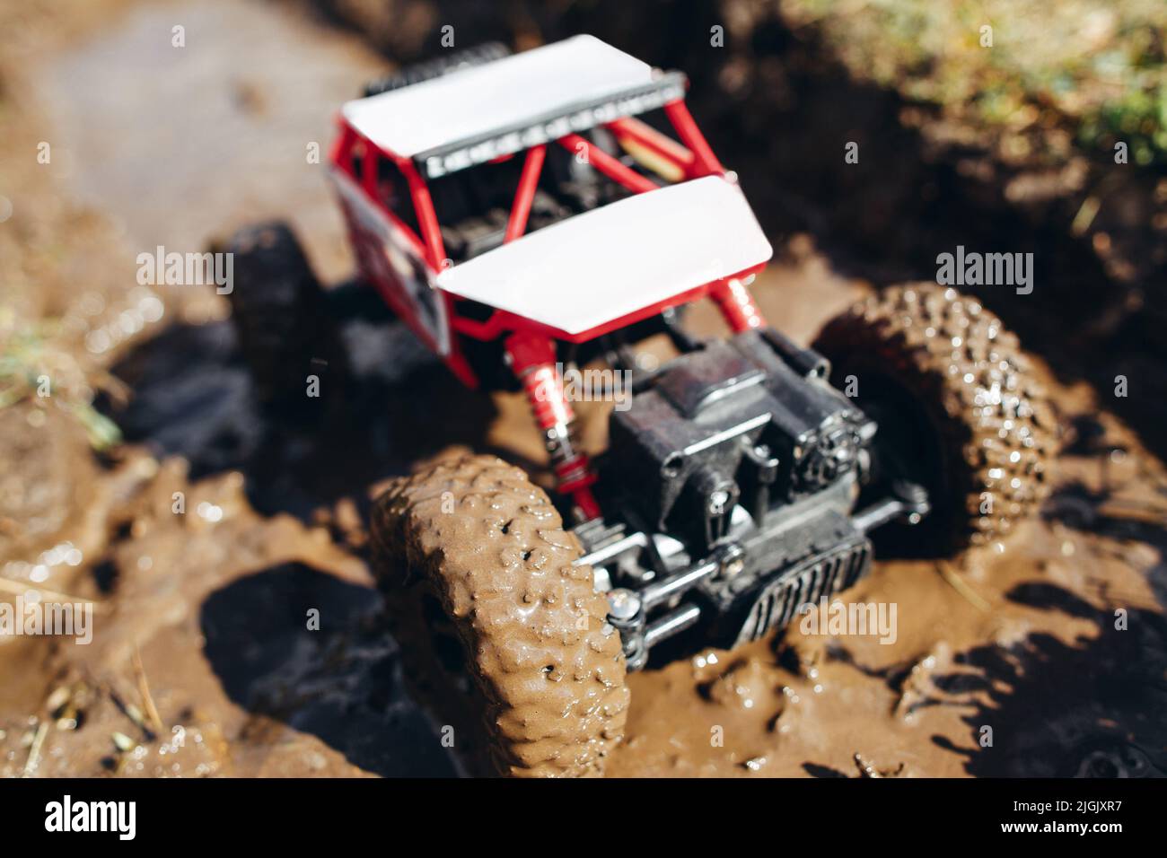 Toy crawler roading on dirty track, close-up Stock Photo - Alamy