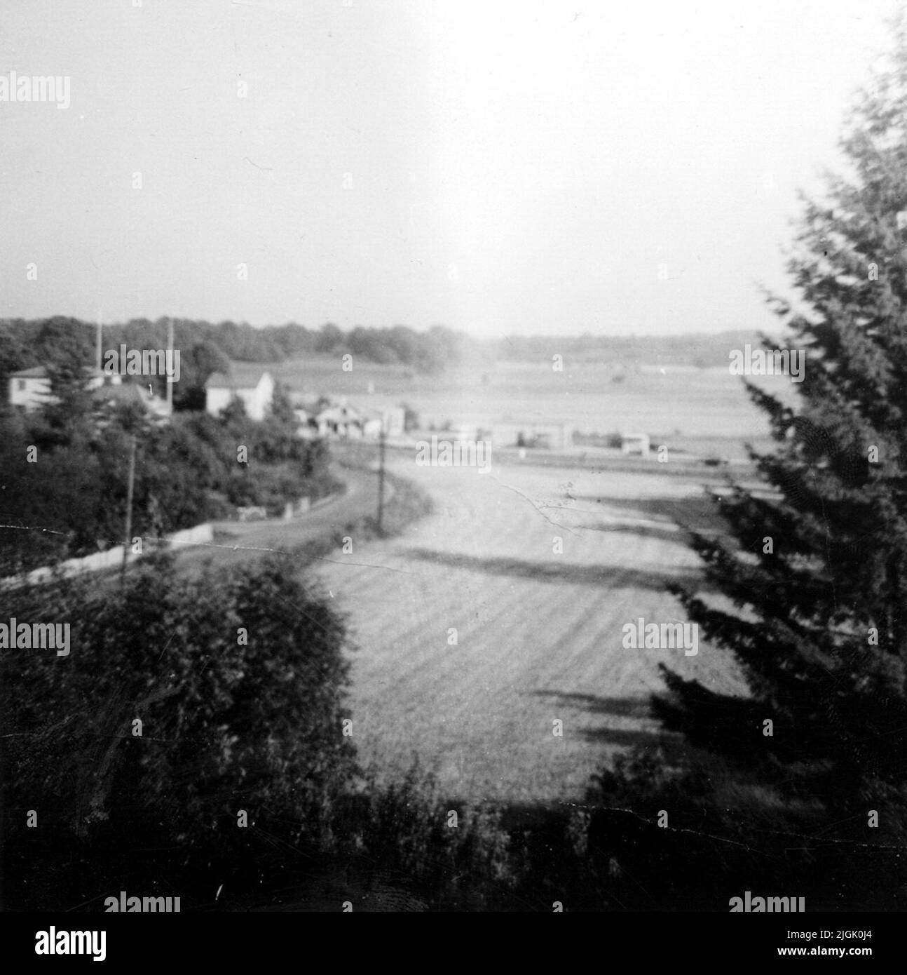 Bostadshus Photographed to the east from the ghost villa or ghost castle which was located in the Backabo district next to the present Rosenholmsvägen to the left in the picture. Was called Östra-West road at the photo opportunity. The ghost villa was demolished about 1966 and was about where the Kalven block is today. In the background, Lyckebyvägen. Stock Photo