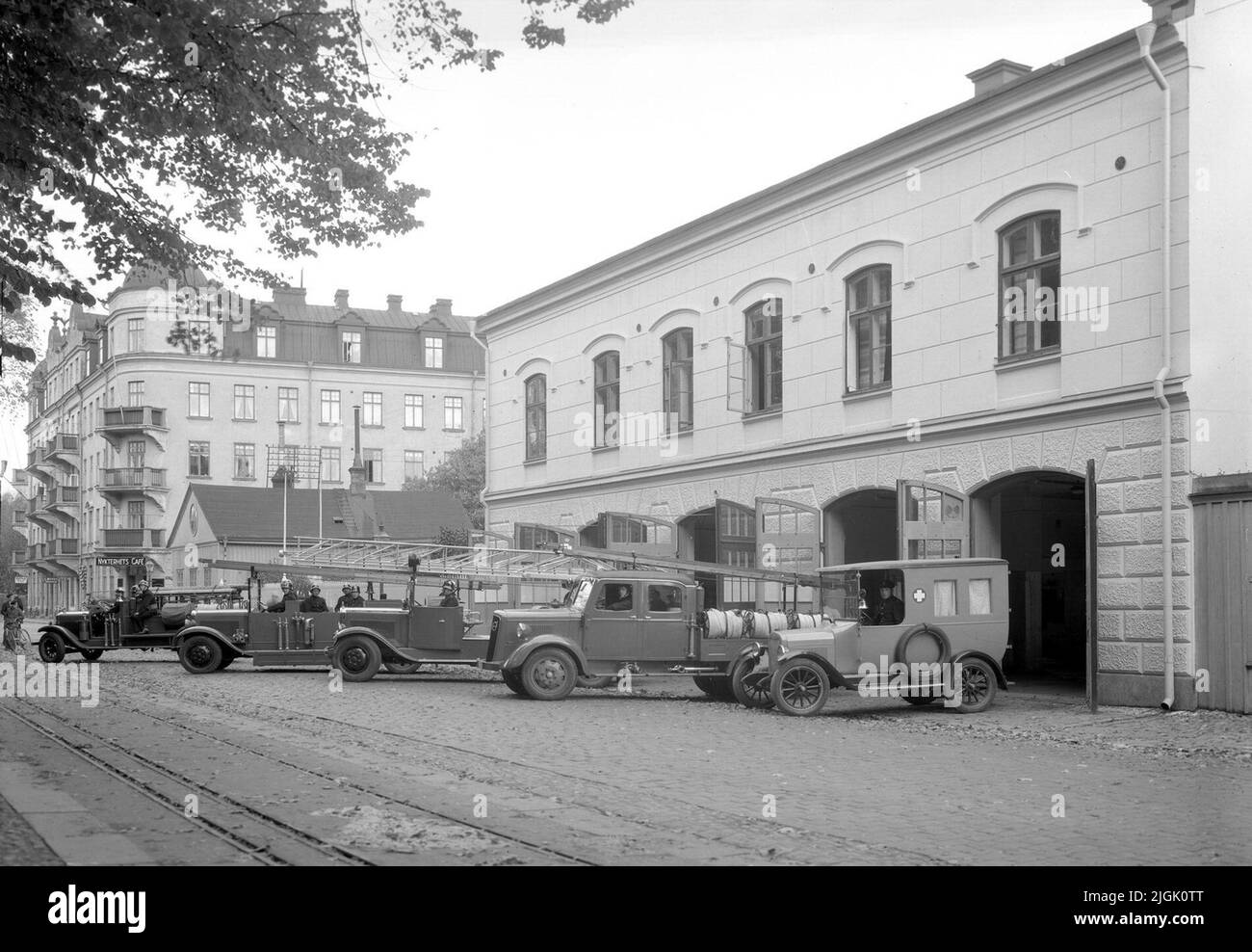 Brandstation Old fire station, with fire trucks and an ambulance, on