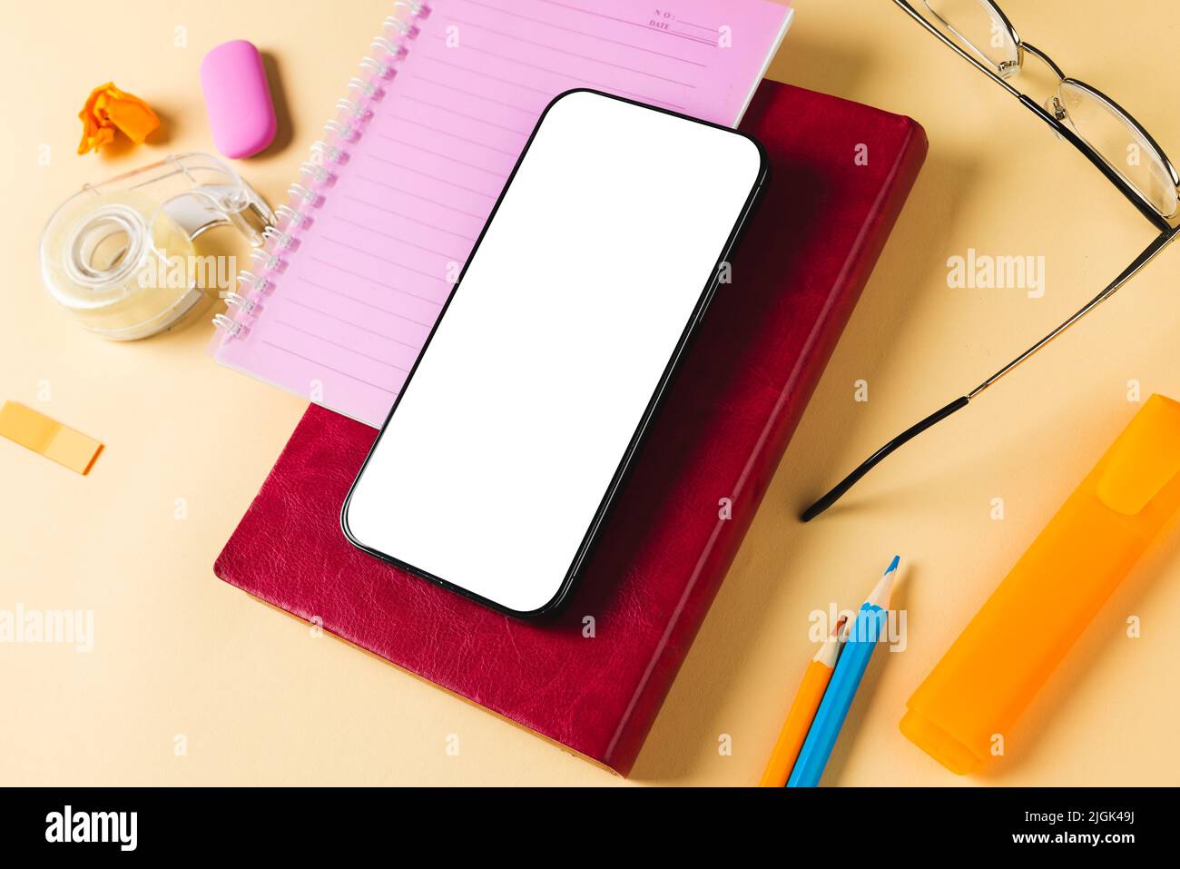 Phone Composition Composition of smartphone with copy space, notebooks, glasses and ...
