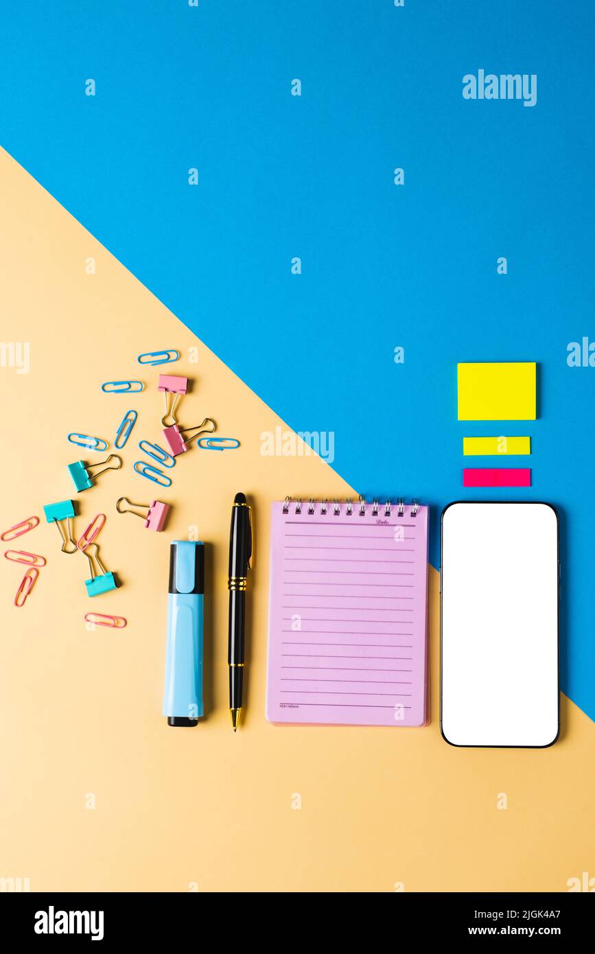Phone Composition Vertical composition of smartphone with copy space, notebook and tools ...