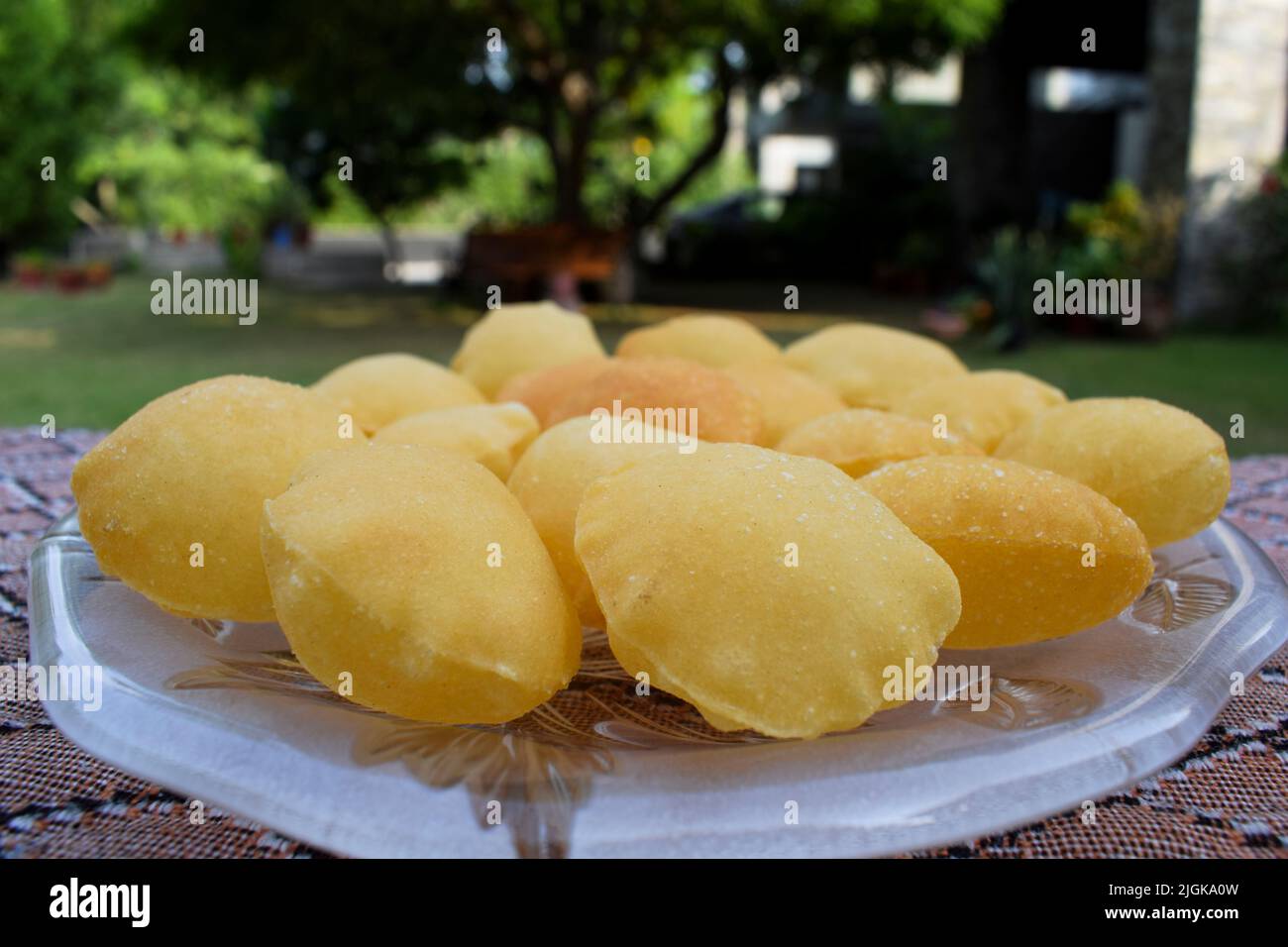 Street food item Pani puri or Gol gappa or Puchka. Big size puri used for filling spicy water and potato made of sooji Stock Photo