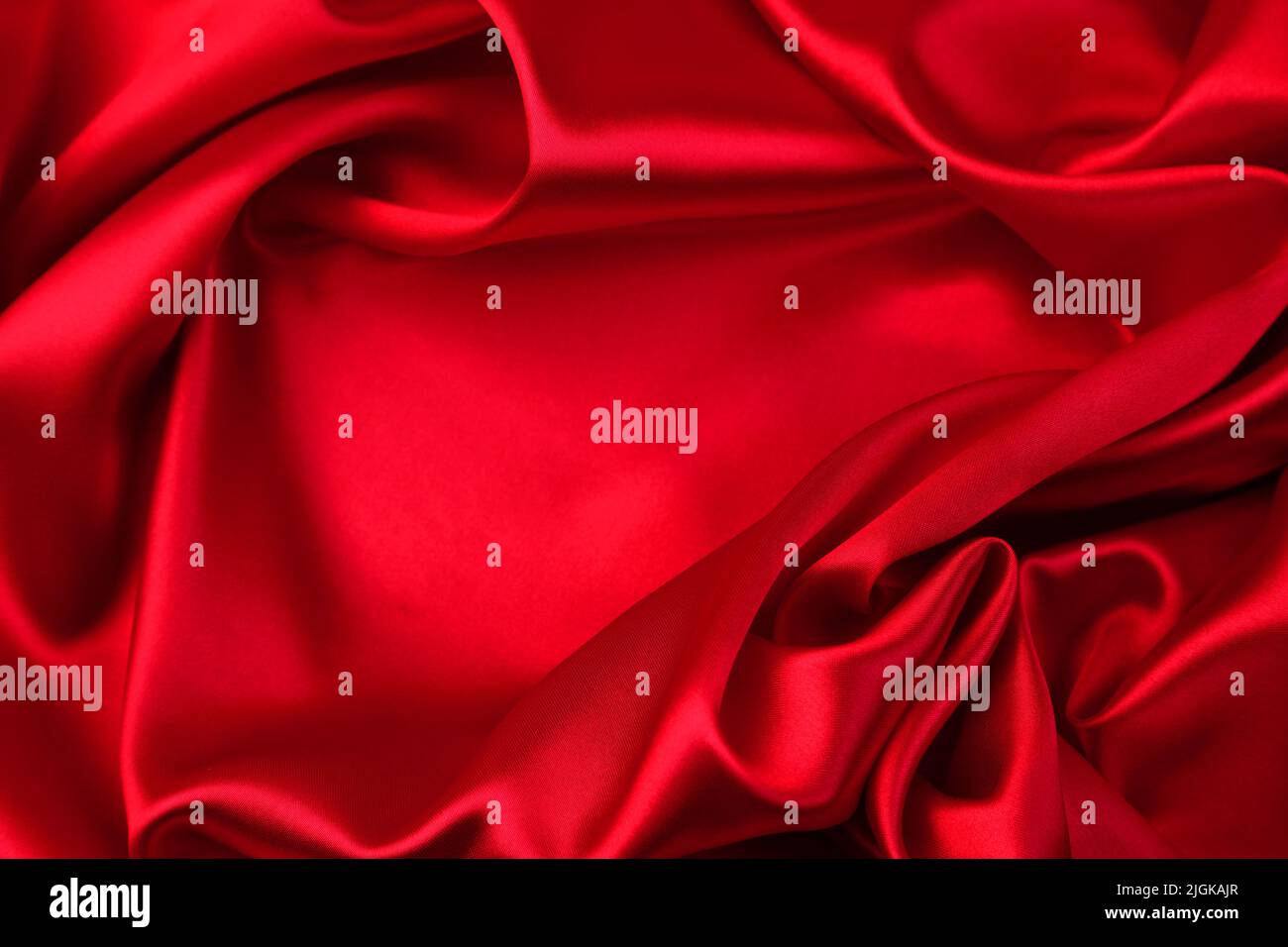 Closeup of rippled red silk fabric Stock Photo