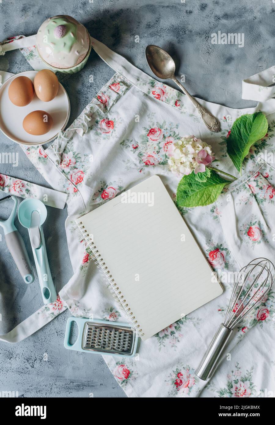 recipe book mockup on kitchen table with kitchen utensils in vintage style Stock Photo