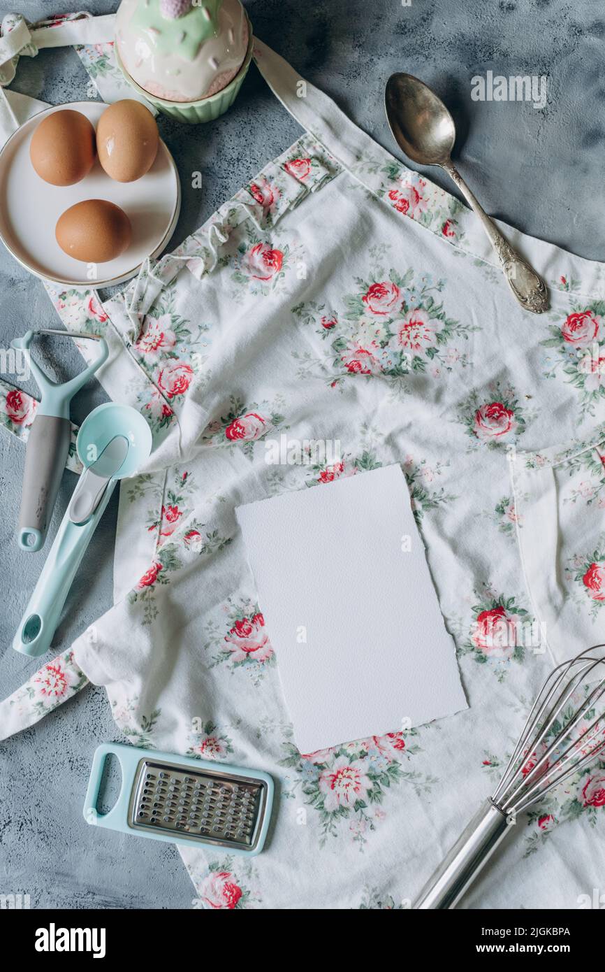 recipe book mockup on kitchen table with kitchen utensils in vintage style Stock Photo