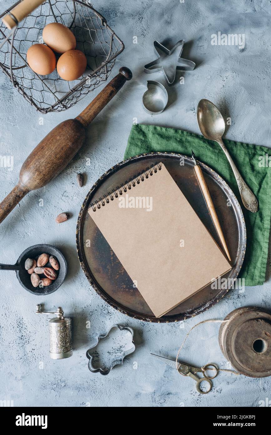 recipe book mockup on kitchen table with kitchen utensils in vintage style Stock Photo