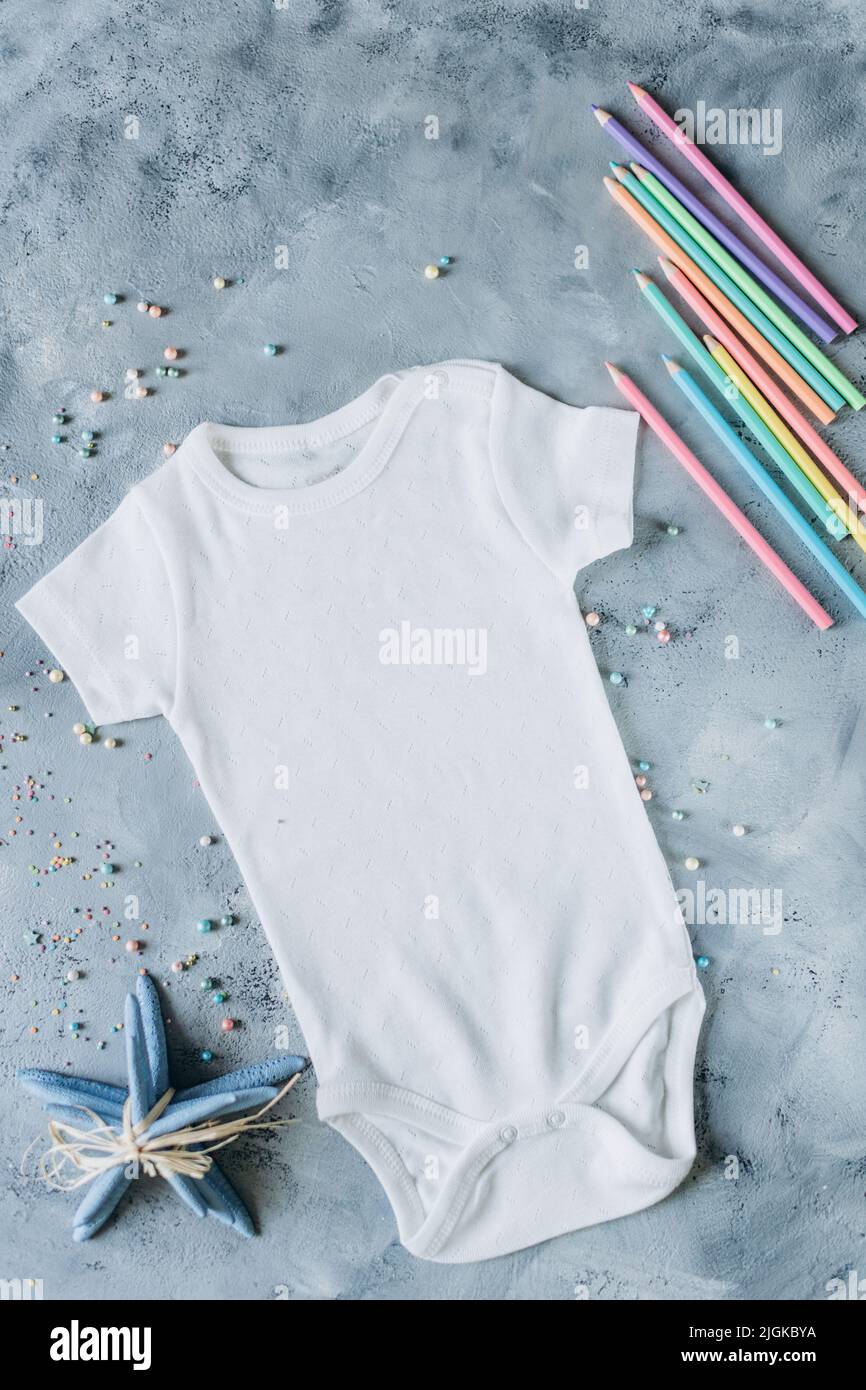 white baby clothes, newborn baby costume mockup Stock Photo Alamy