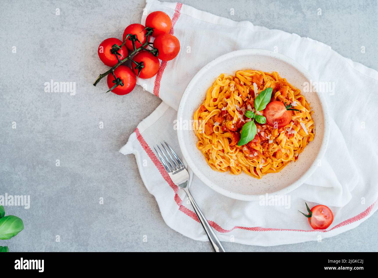 Top view plate of just cooked homemade fettuccine pasta with creamy