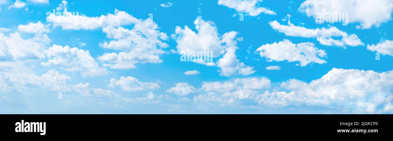 Panoramic background of blue sky with white cumulus clouds Stock Photo