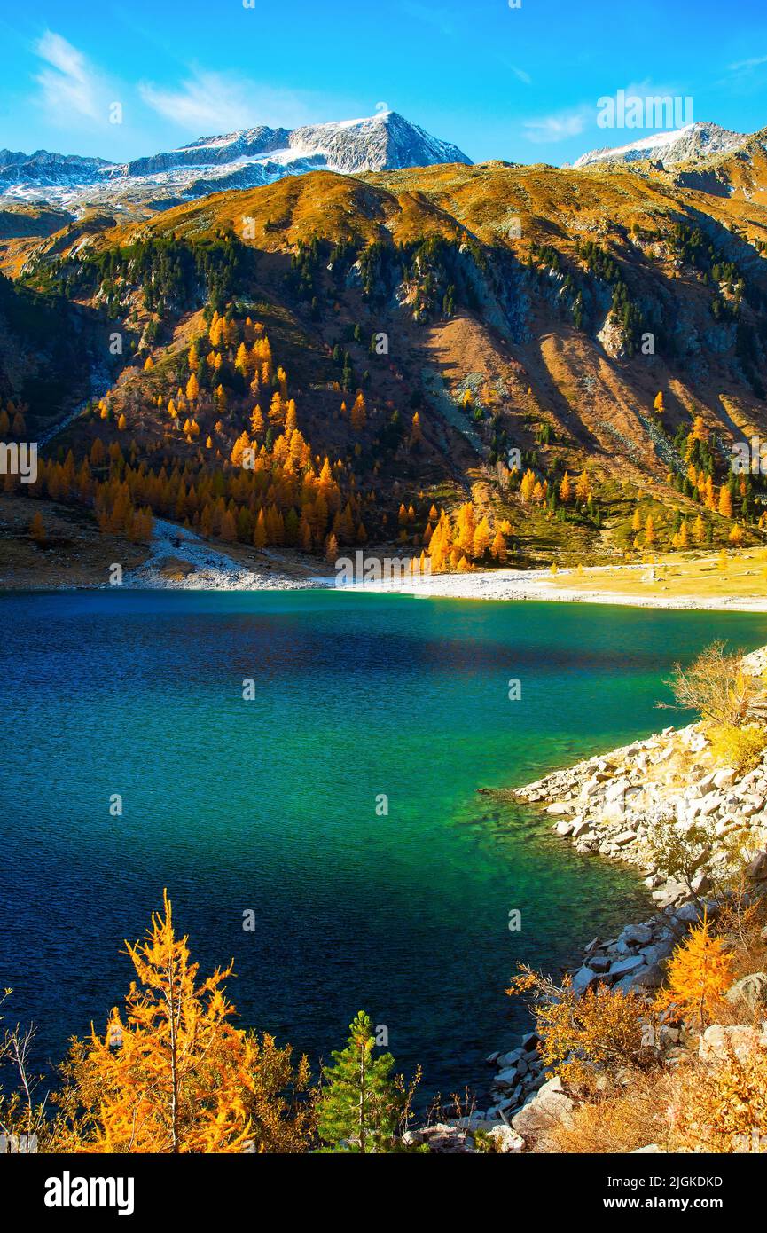 Autumn Alps aerial mountain landscape with turquoise lake and snowy peak, Austria Stock Photo